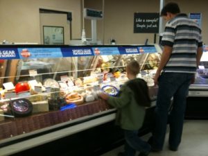 Close examination of the cheese counter.